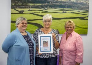 Jenny Cathcart, Judith Clark and Sue Young with the Richmond Toilet Twinned Town Certificate