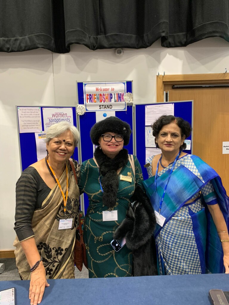 2022-With-Sandra-Ajax-FLO-SI-Cardiff-Bhaswati-Biswas-SIGBI-Friendship-Link-Coordinator-2018-2022-and-Shukla-Chattopadhyay-SIGBI-APD-Prosperity-2022-2024-at-the-Friendship-Link-Stand-Belfast