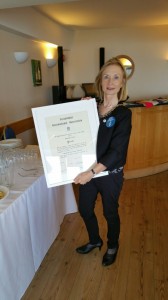 President Liz proudly displays SI Poole's Charter.