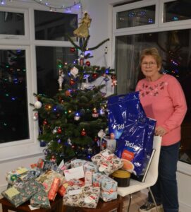 Barbara Saunders with Soroptimist gifts for refuge 2025