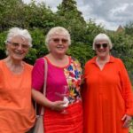 Jane with orange ladies from New Ground Cohousing