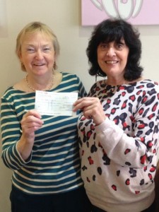 Soroptimist Jackie giving cheque to Rosa