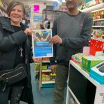 IWD2022 Cathy distributes posters in Weybridge