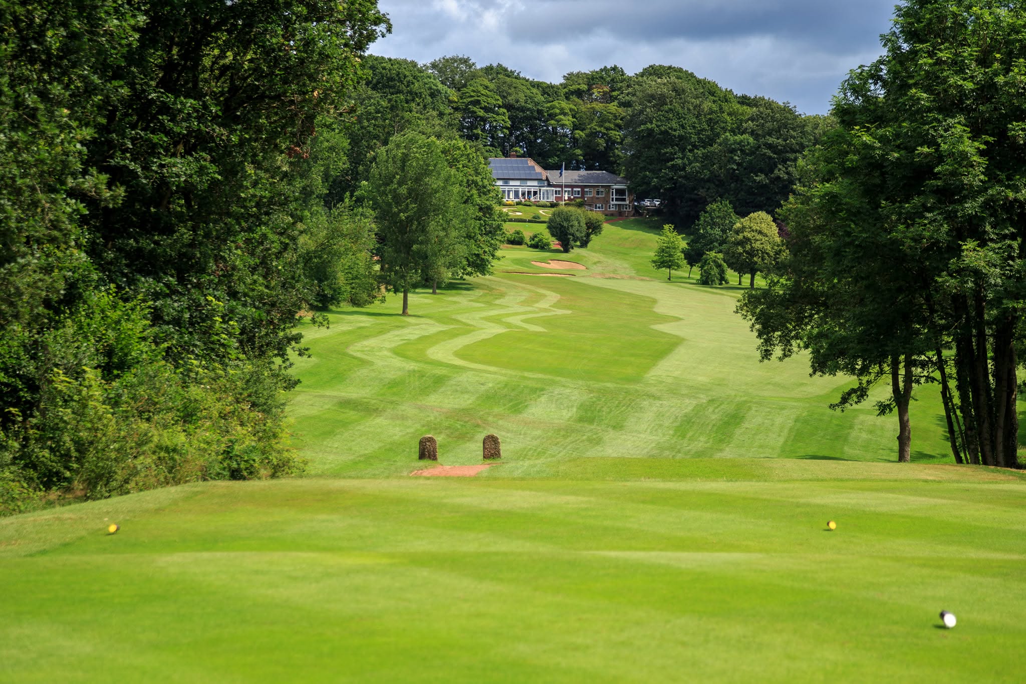 A photograph of Chesterfield Gold Club showing the green and clubhouse.